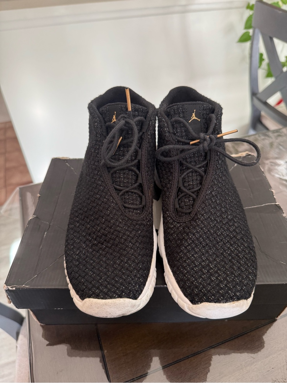 Jordan Men’s Black Knit Athletic Shoes with Gold Accents